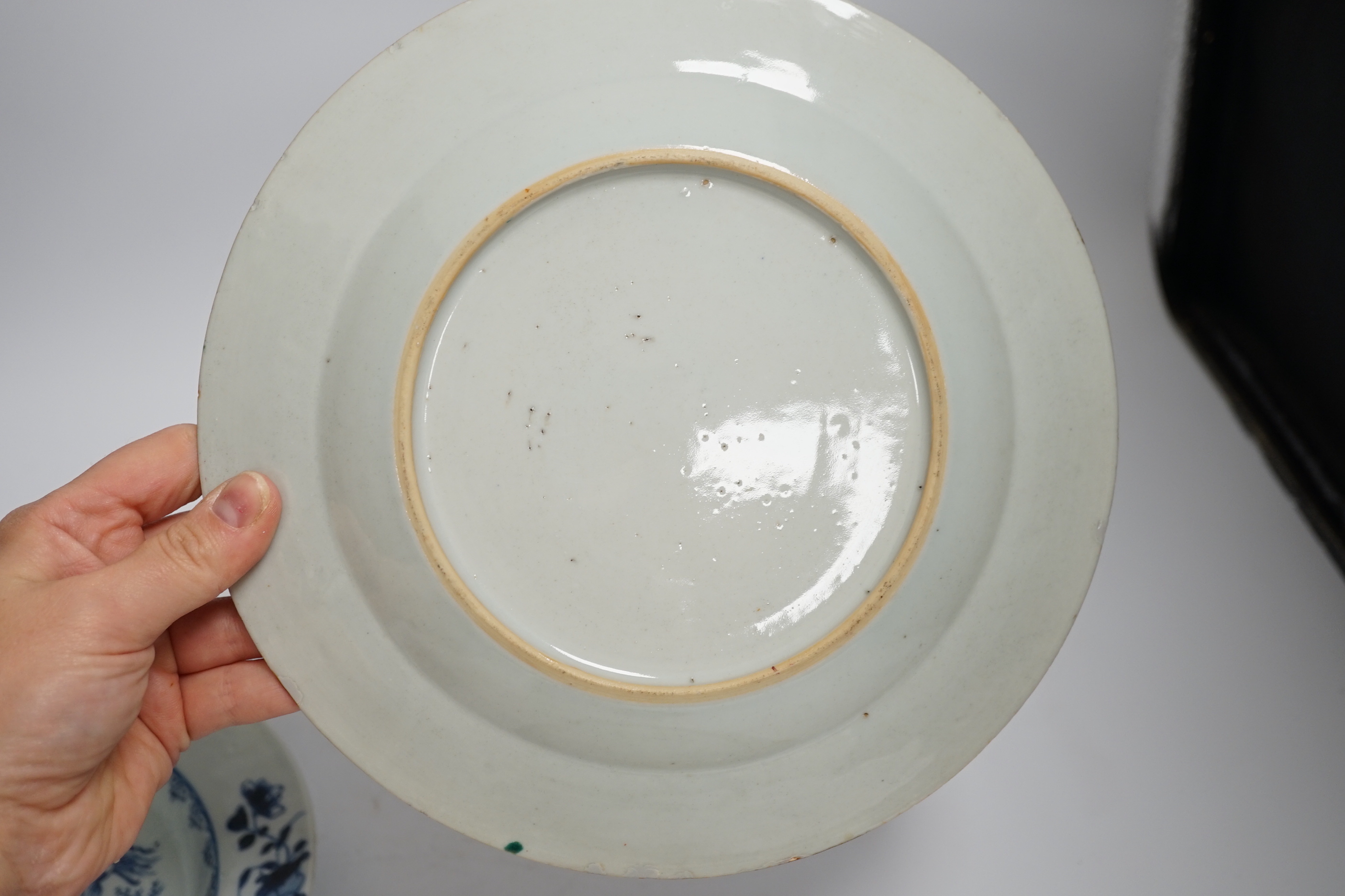 Two 18th century Chinese export plates and a 19th century Canton plate, largest 23cm